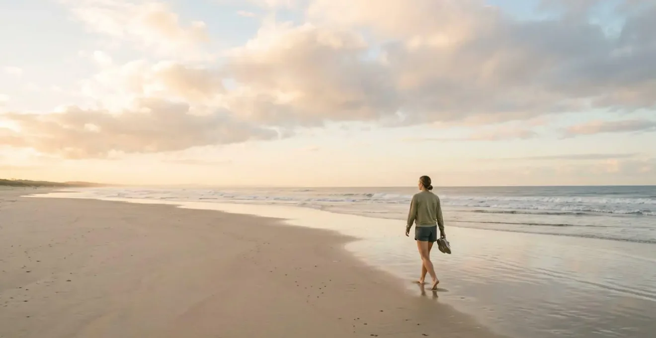 Wide shot of athlete in serene outdoor environment performing gentle recovery exercise